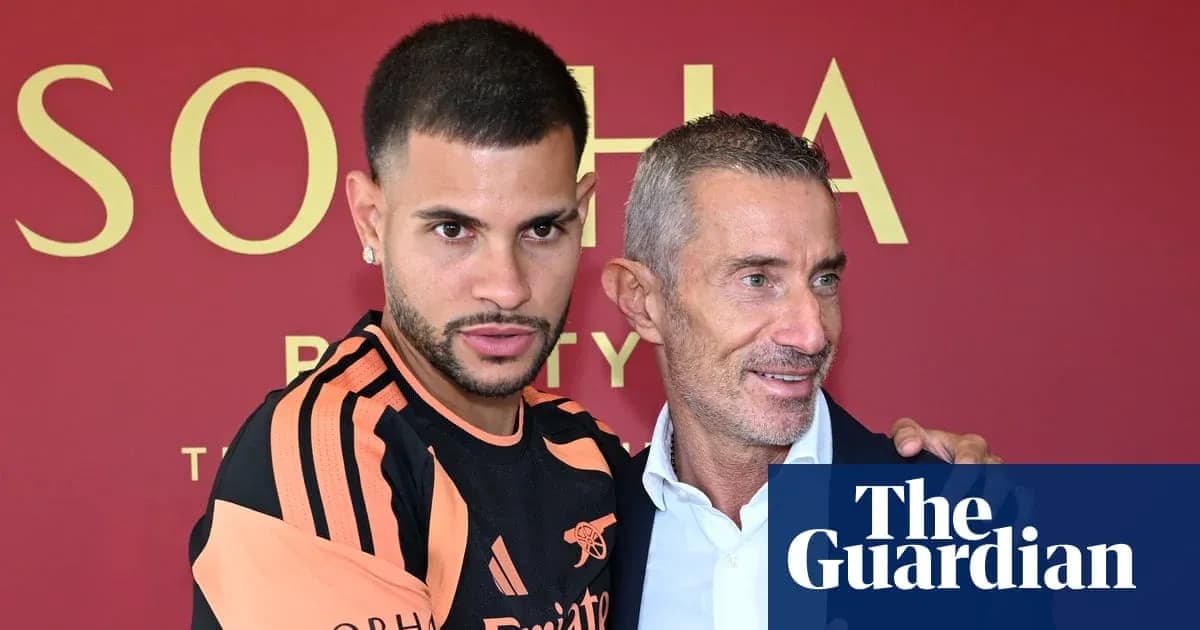 Player posing with manager at press event