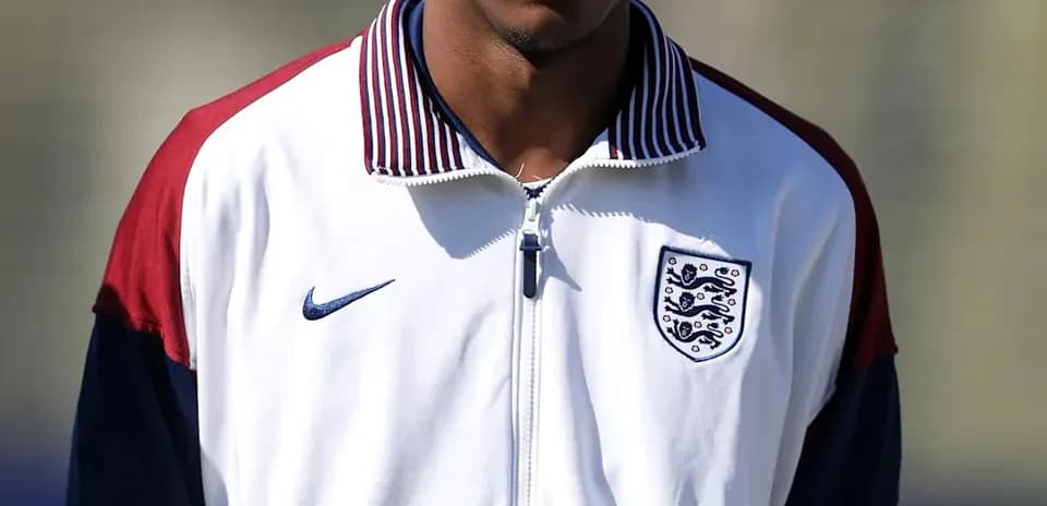 Player wearing England training jacket on field