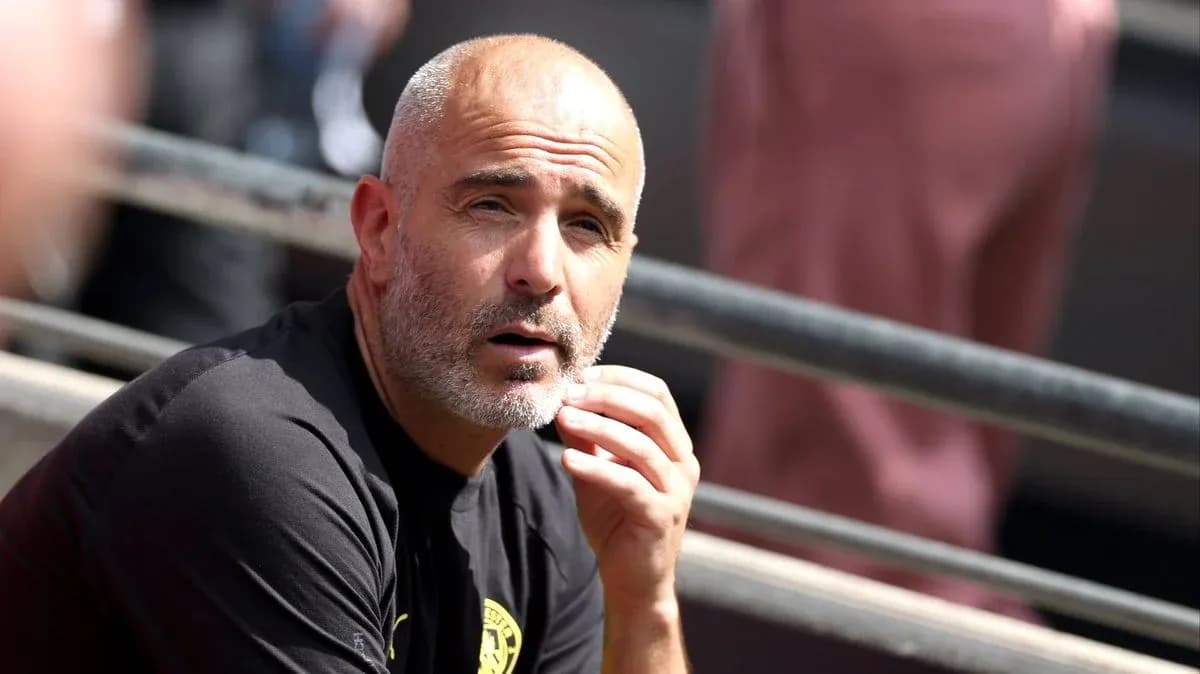 Coach sitting on bench during match observation