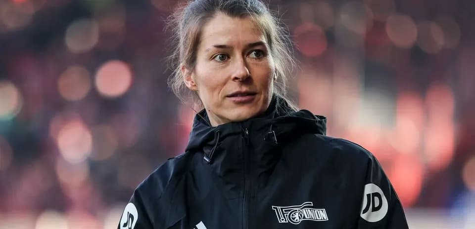 Woman in sports jacket during event