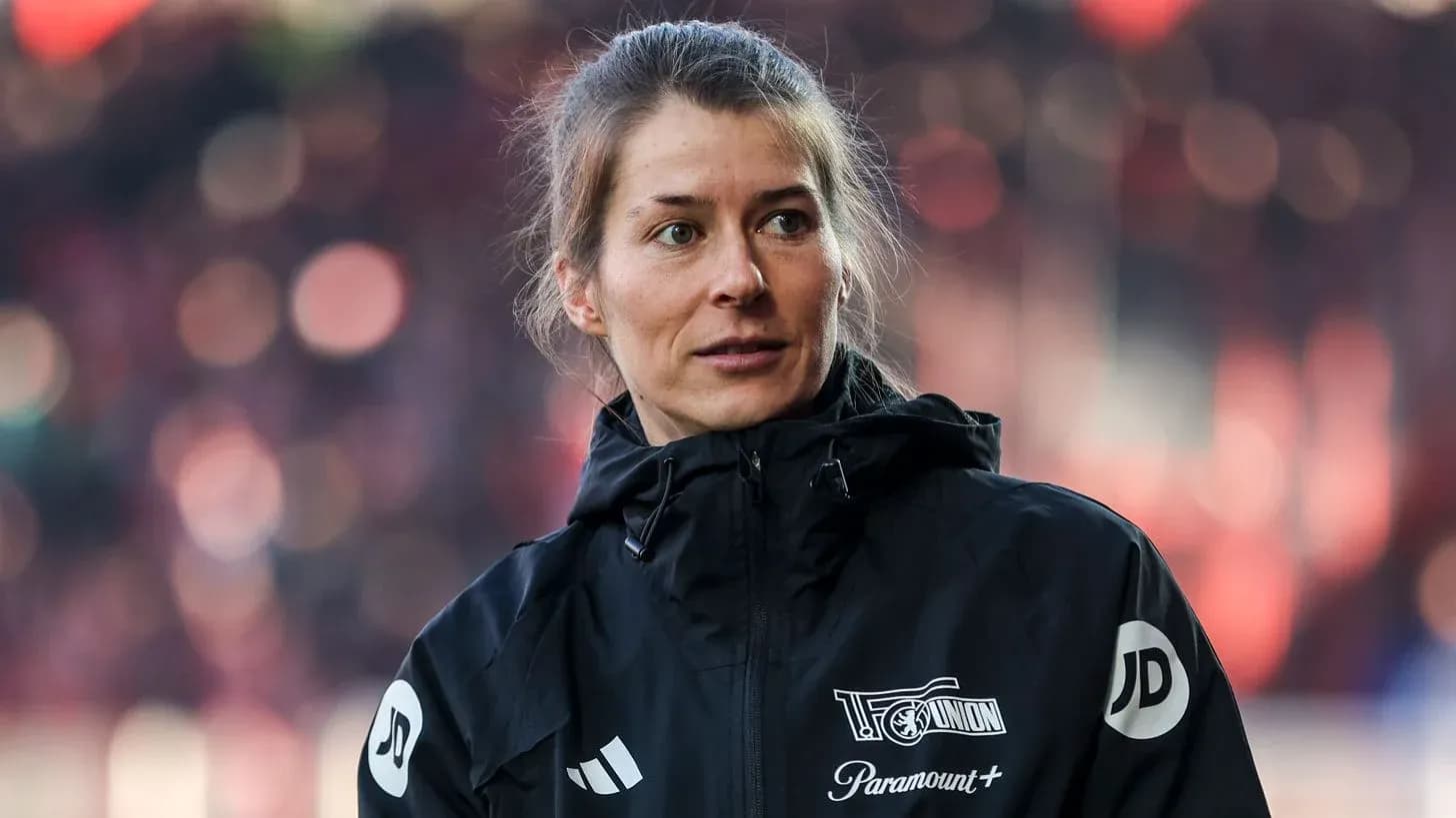 Woman in sports jacket during event
