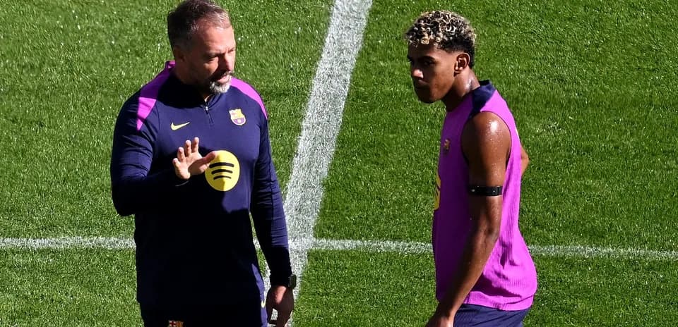 Coach discussing with player during training session