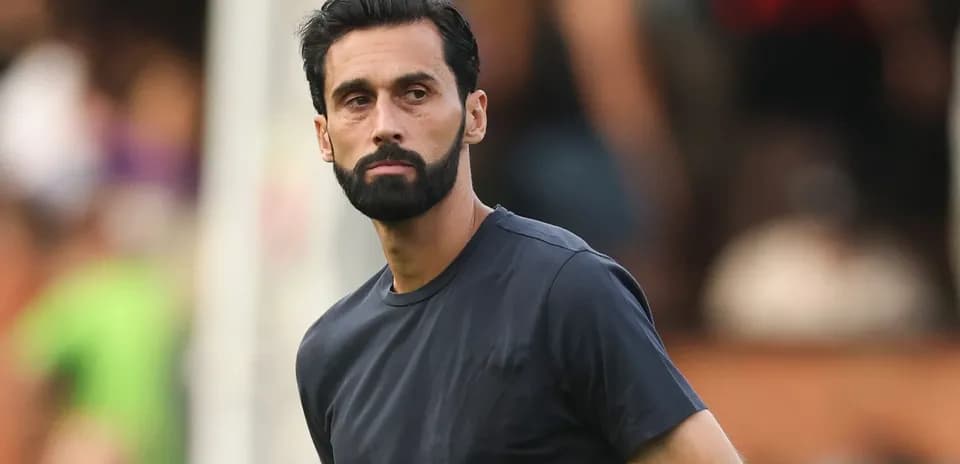 Man in black shirt on sports field