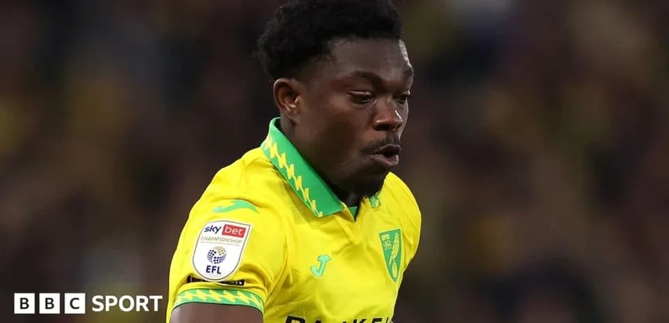 Player in yellow kit running on the field