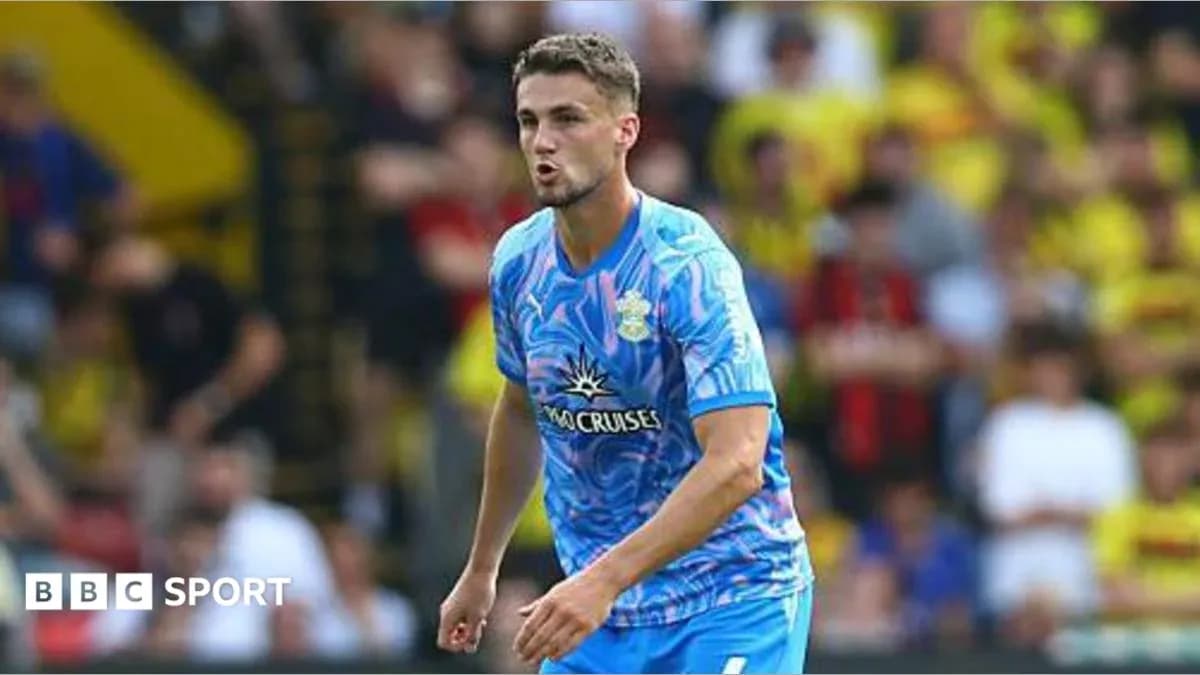 Player in blue kit during match action