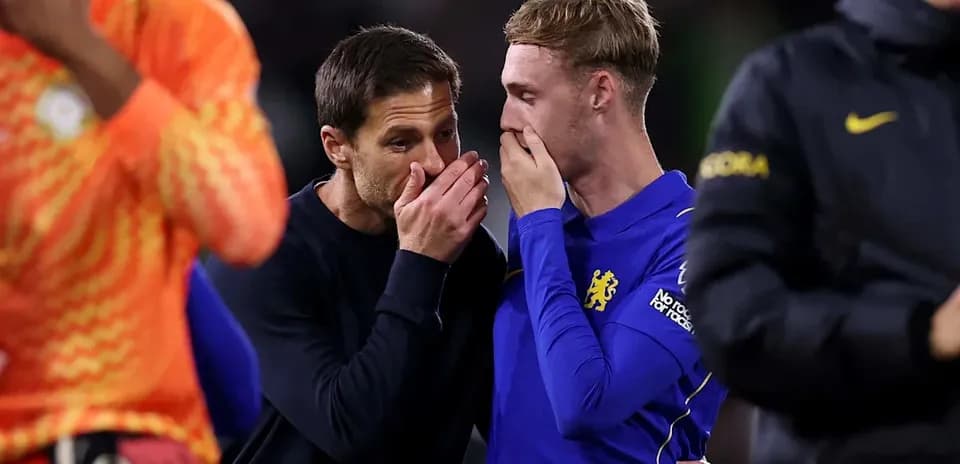 Coach discussing with player after match