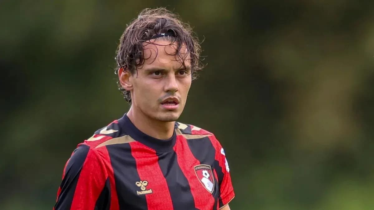 Player in red and black jersey during match