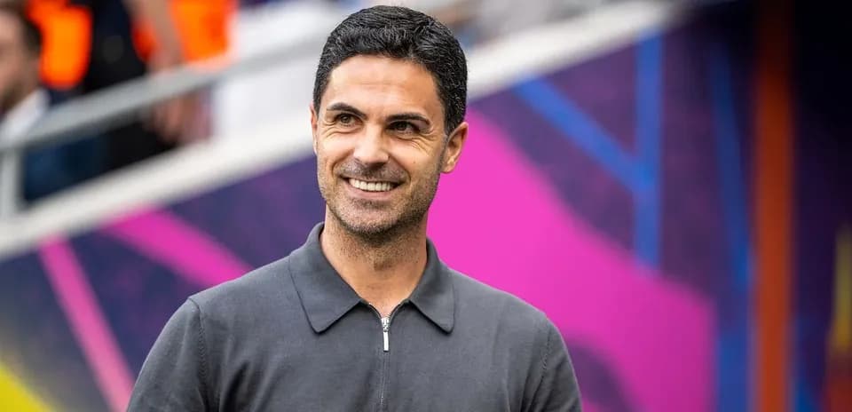 Coach smiling before a match in stadium