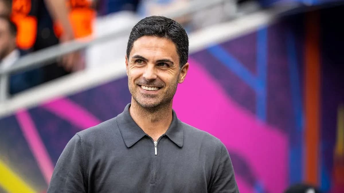 Coach smiling before a match in stadium