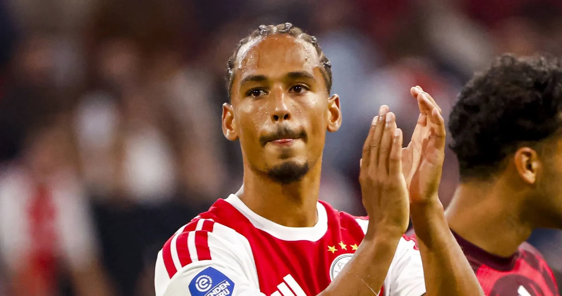 Player applauding fans after the match