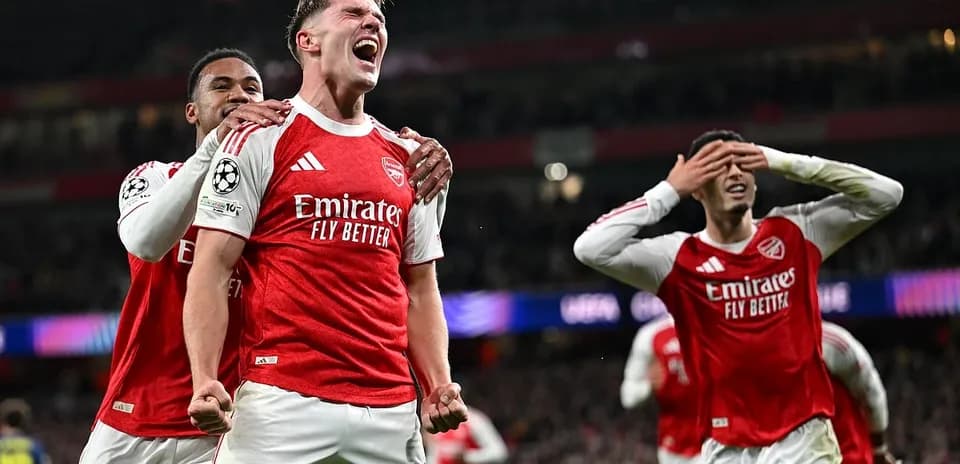 Arsenal players celebrating a goal in Champions League