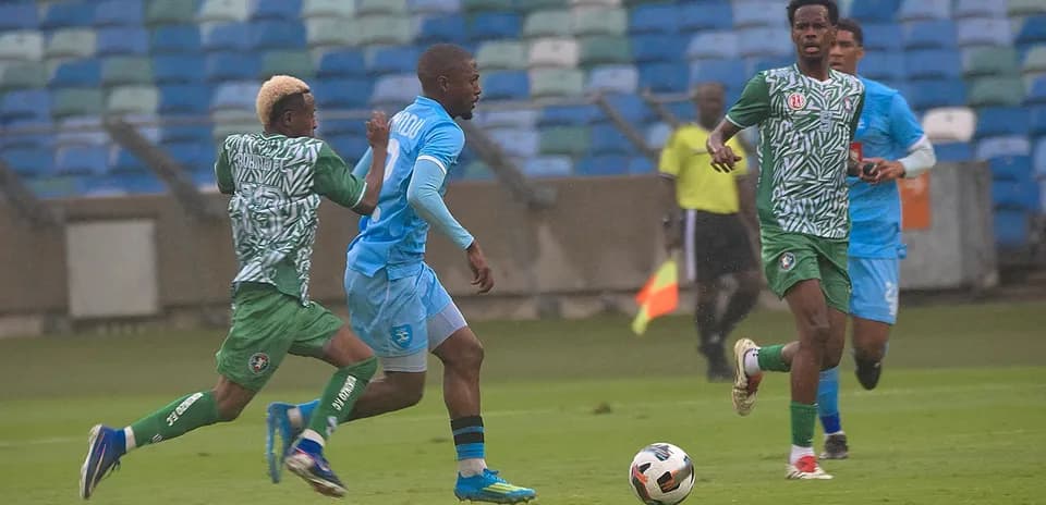 Players competing for the ball in CAF Confederation Cup