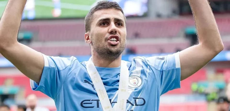 Player celebrating with medal after match victory