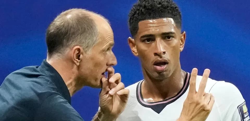 Coach discussing strategy with player during match