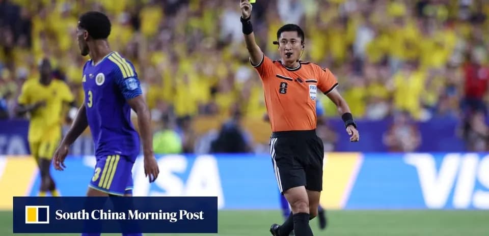 Referee showing a yellow card to a player