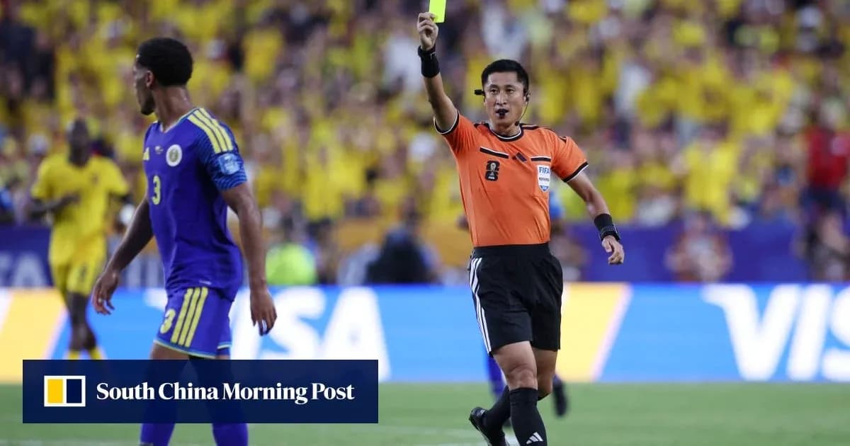 Referee showing a yellow card to a player