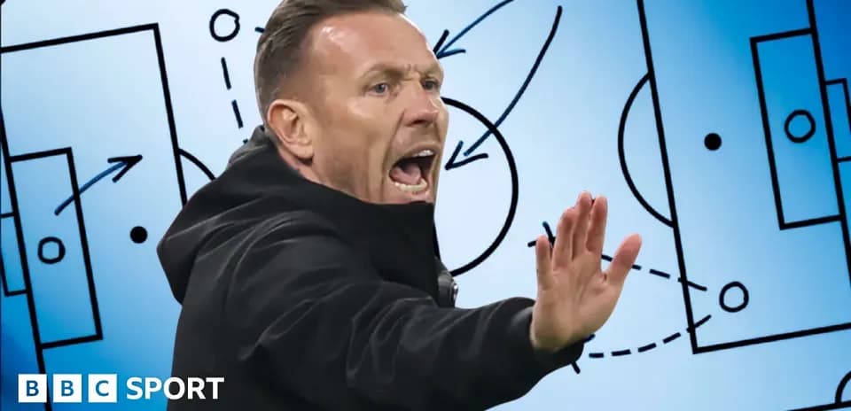 Coach gesturing during tactical discussion with diagram