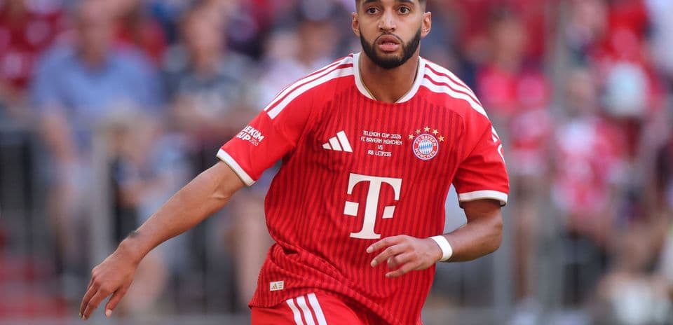 Player in red Bayern Munich jersey running on field