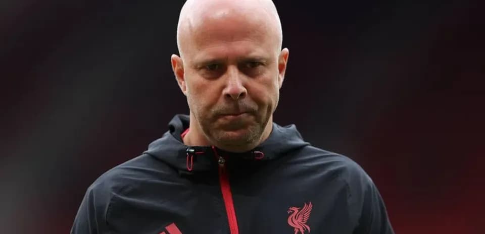 Liverpool coach walking onto the pitch before match