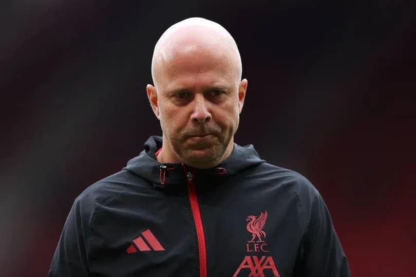 Liverpool coach walking onto the pitch before match