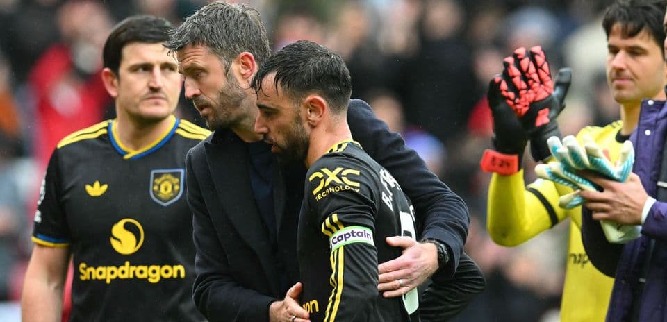 Bruno Fernandes receiving support from coach after match