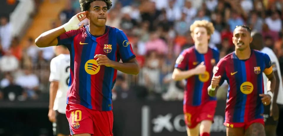 Barcelona players celebrating a goal against Valencia