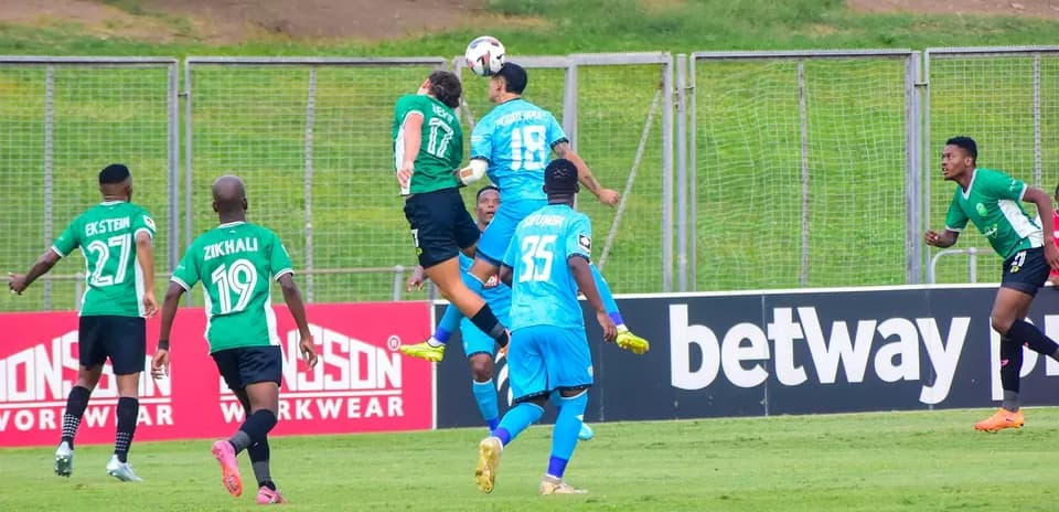 Players contesting for the ball in CAF match