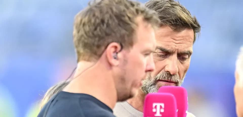 Two men discussing into microphones during broadcast
