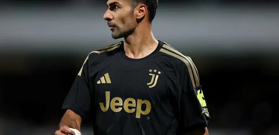 Goalkeeper in Juventus black kit during match
