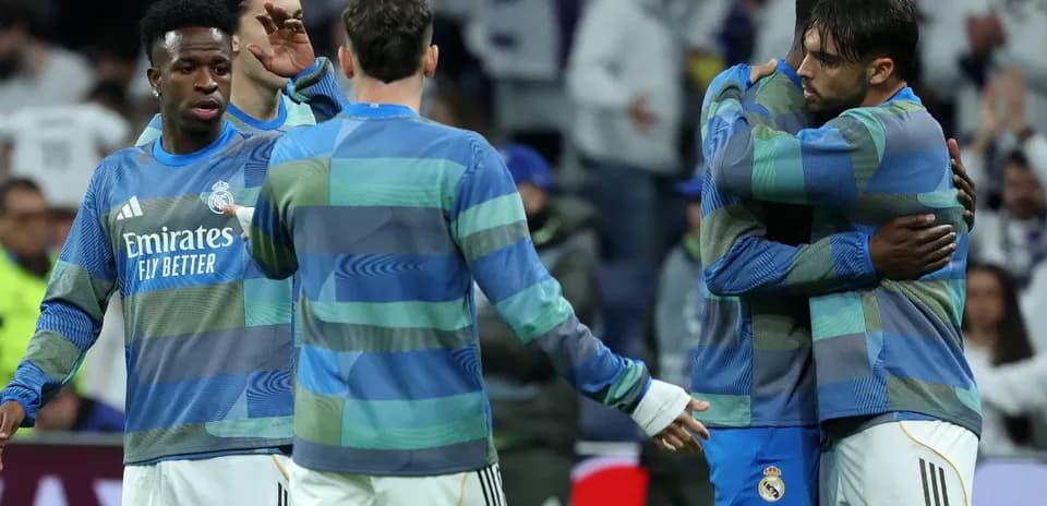 Real Madrid players warming up and embracing each other