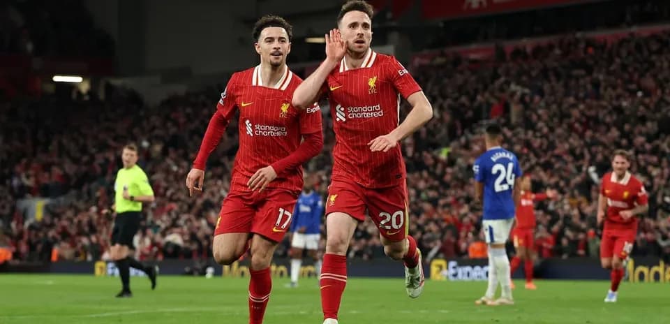 Liverpool players celebrating a goal against Everton