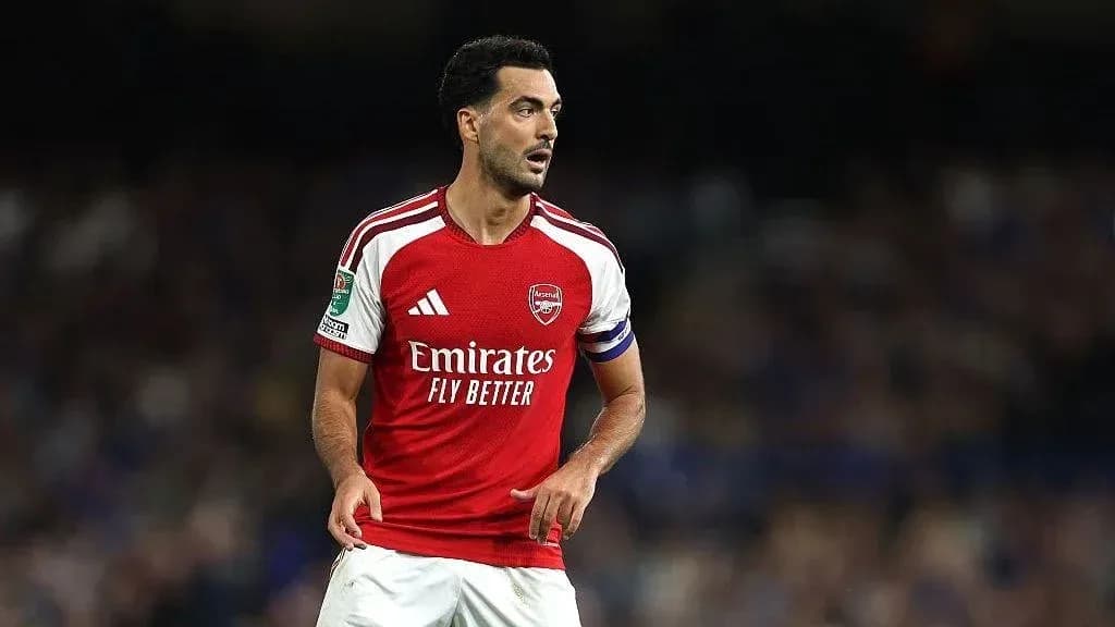 Player wearing Arsenal kit during match action