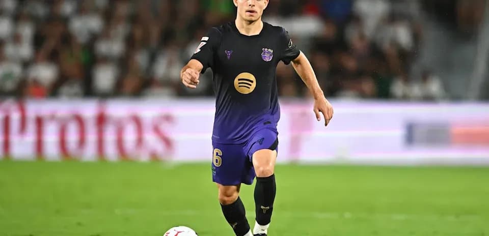 Player dribbling ball during match on field