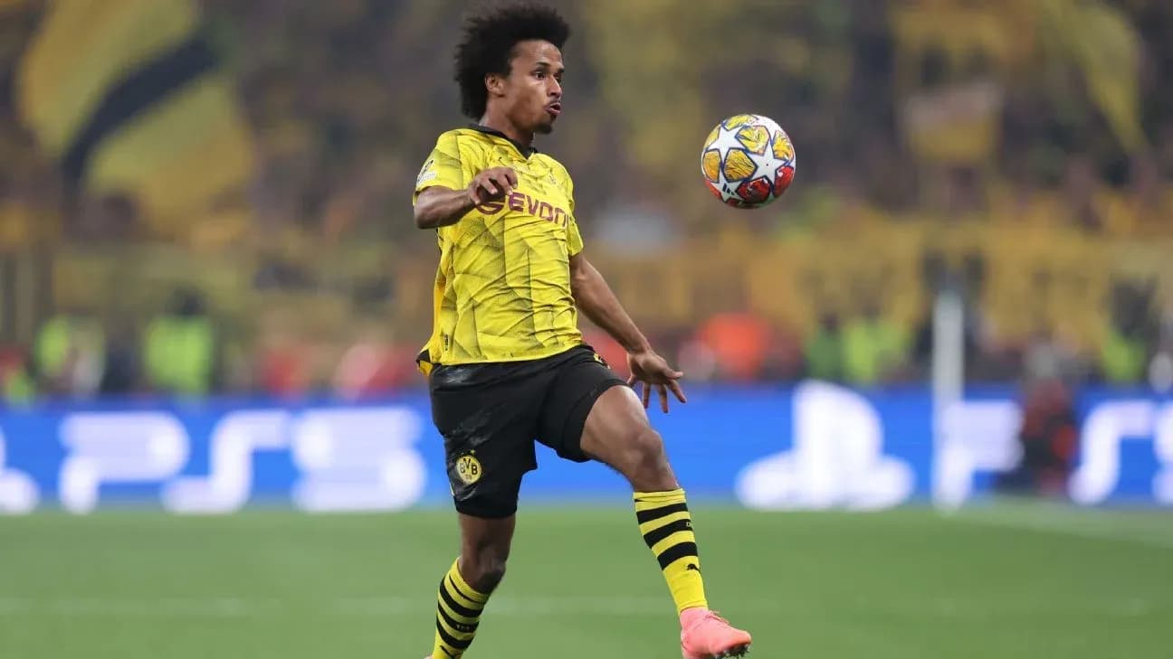 Player in yellow jersey controlling the ball during match
