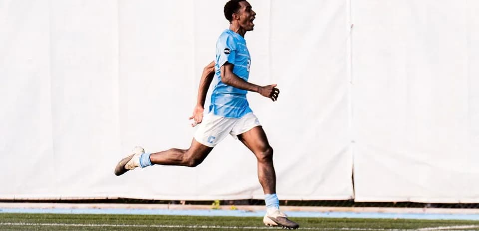 Player celebrating while running on the field