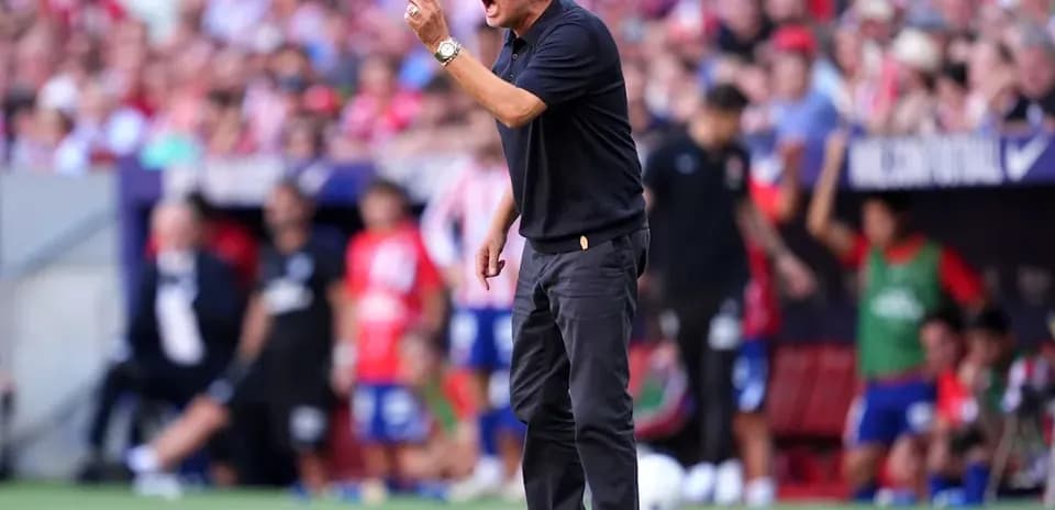 Manager directing players during a match