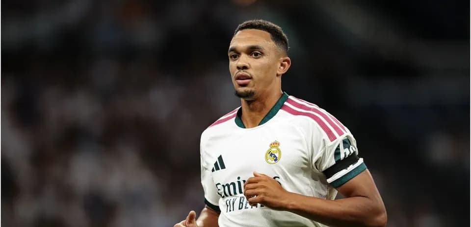 Player in Real Madrid jersey running on field