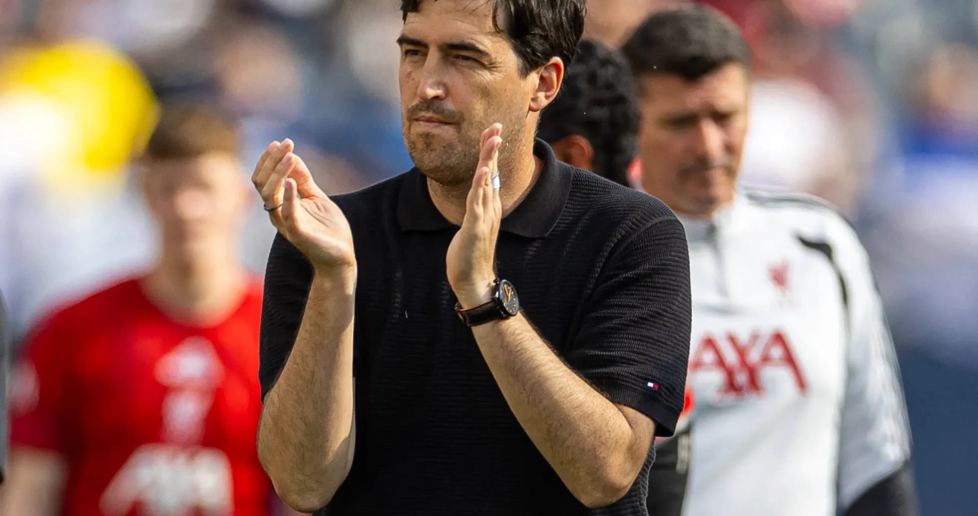 Coach applauding during a match at the stadium