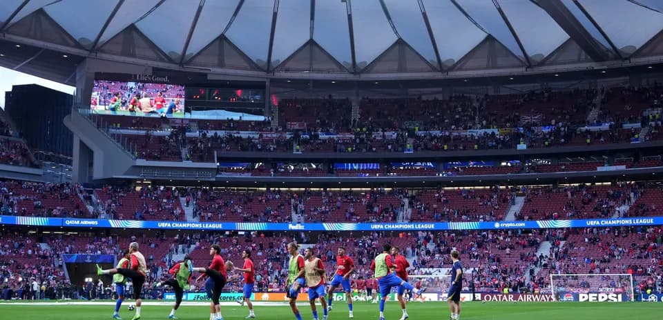 Players warming up on the pitch before match