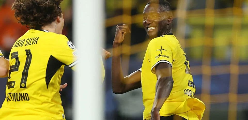Two Borussia Dortmund players celebrating a goal