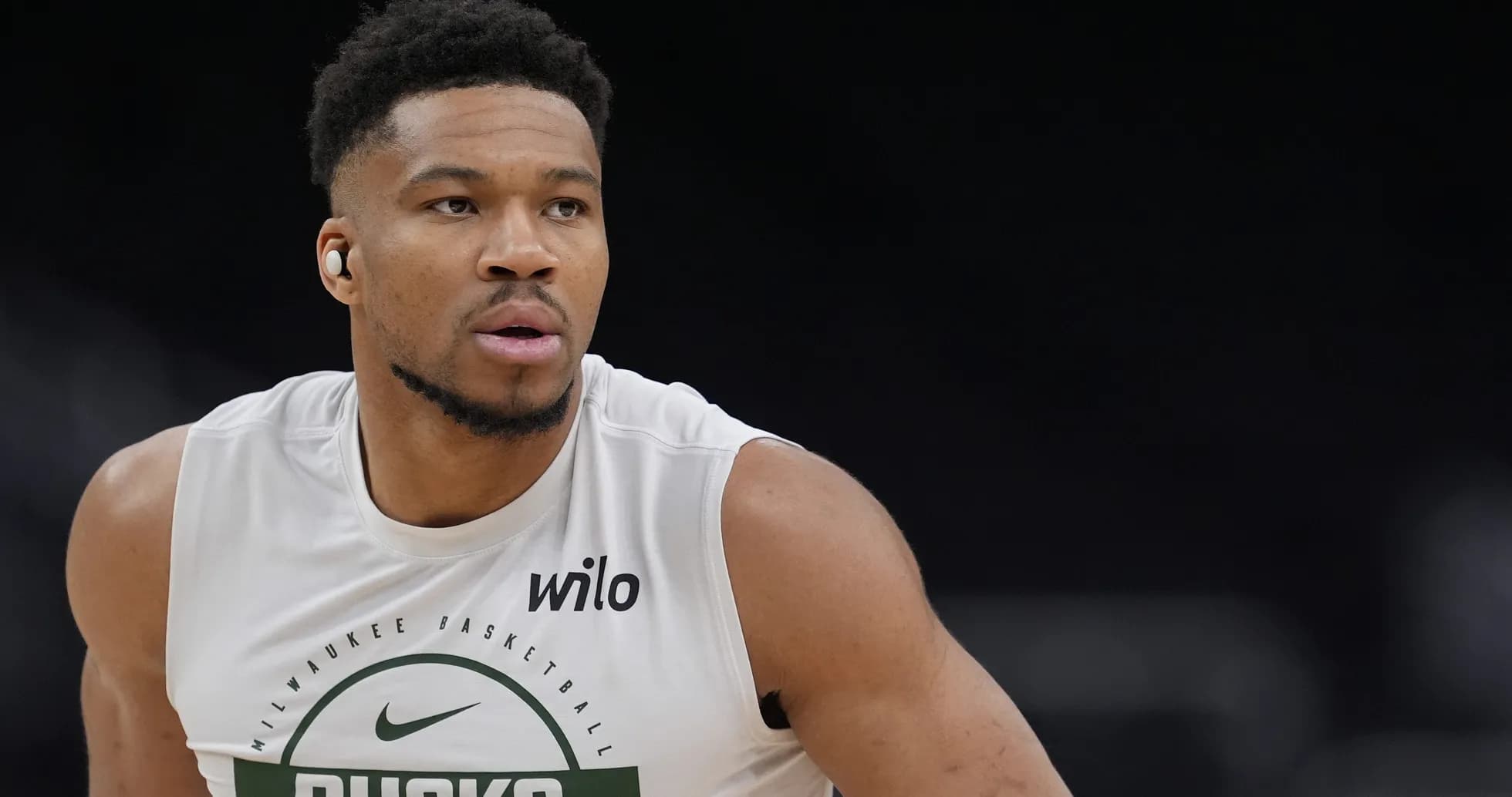 Player in Milwaukee Bucks gear during warm-up