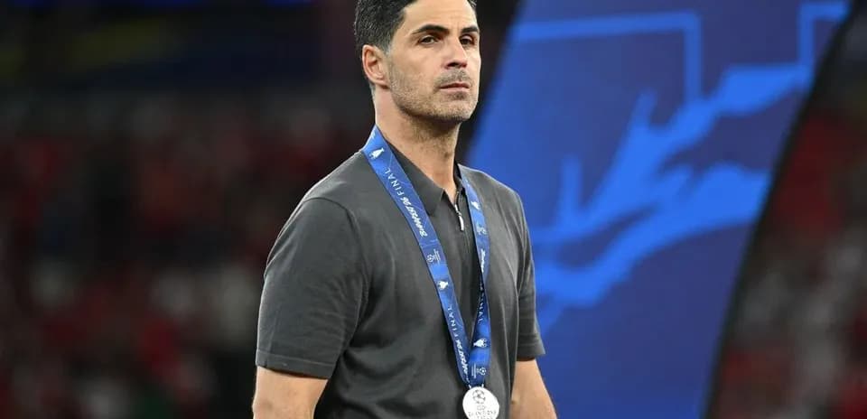 Manager wearing silver medal after match