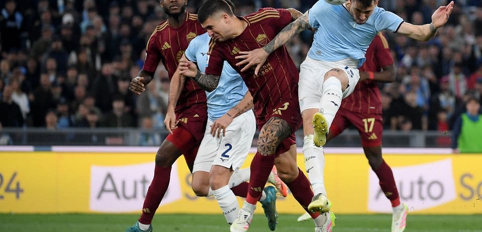 AS Roma players challenging Lazio for the ball