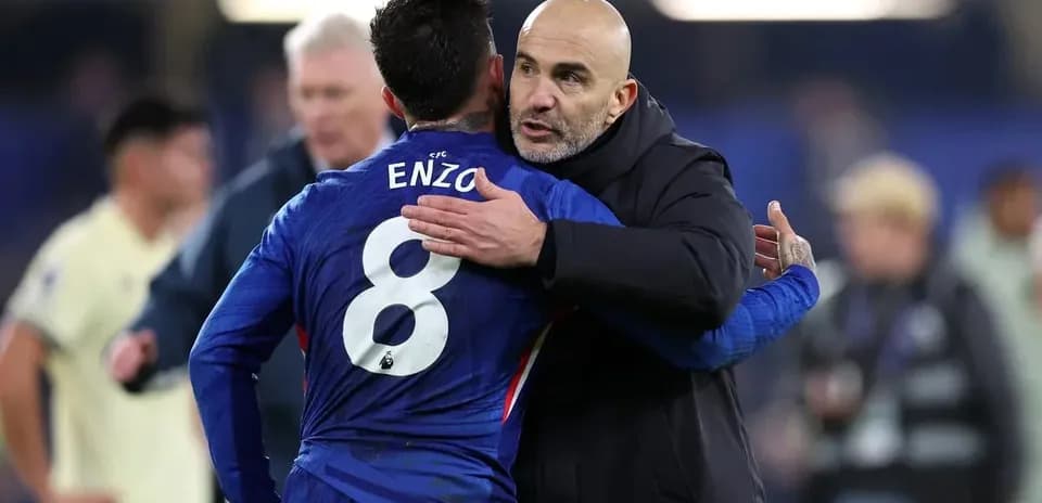 Coach embracing player after the match