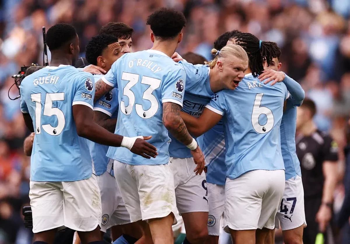 Manchester City players celebrating a goal