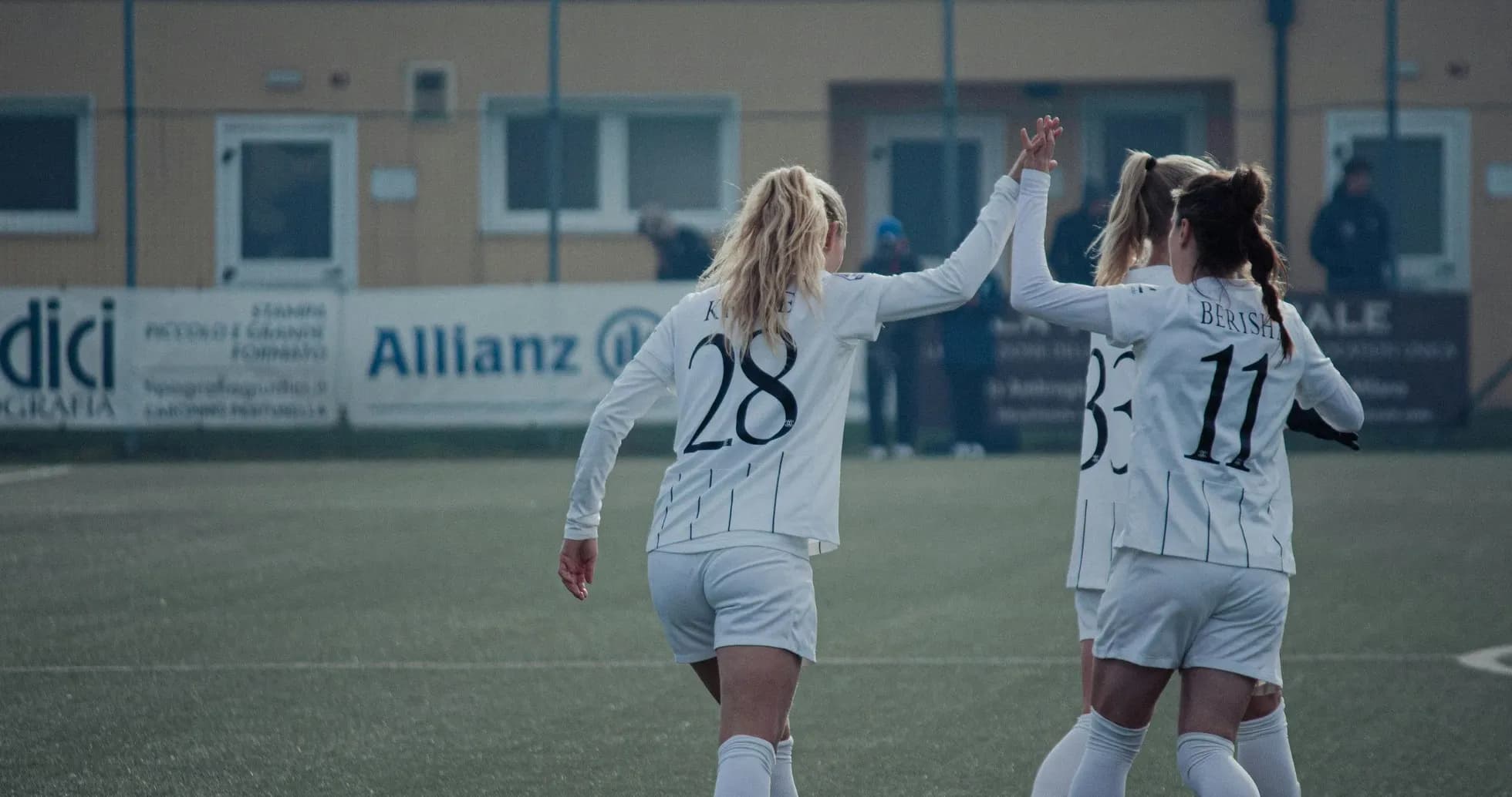 Players celebrating a goal during match
