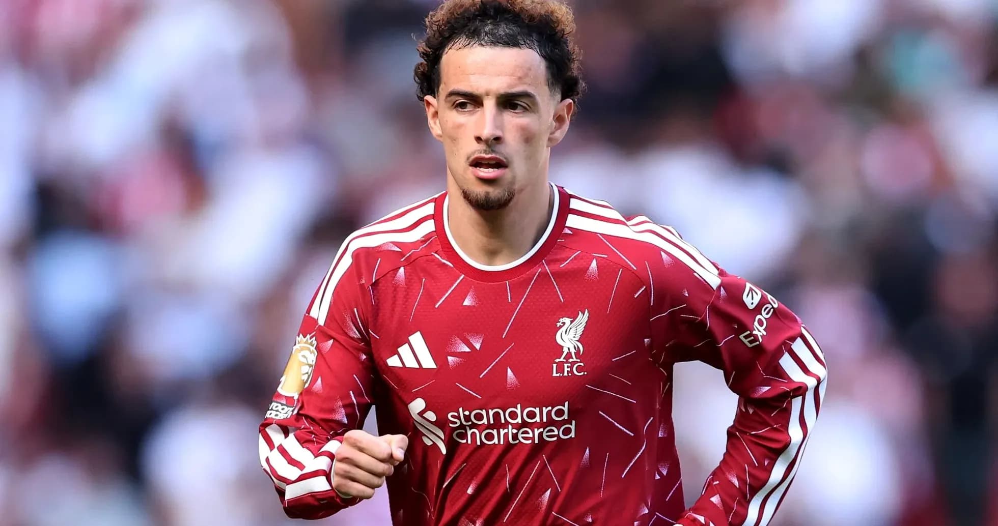 Liverpool player running on the pitch during match
