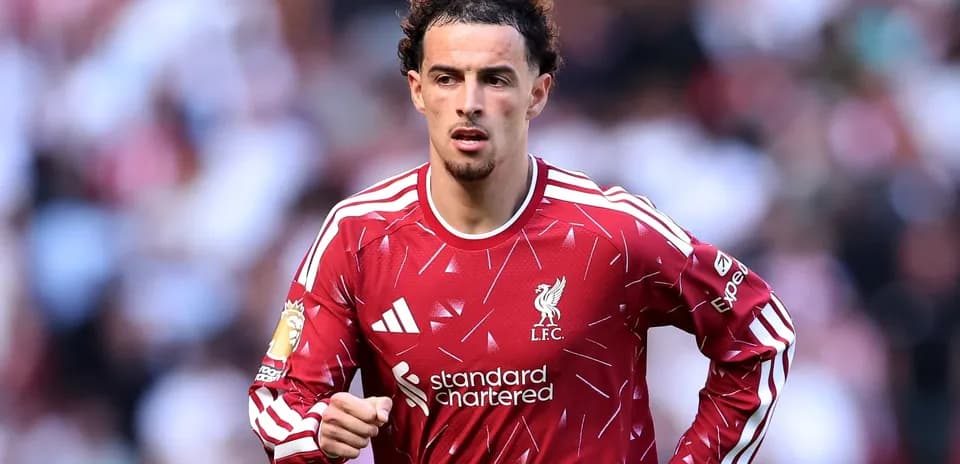 Liverpool player running on the pitch during match