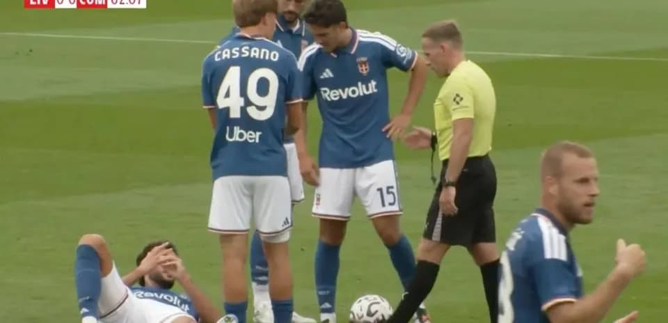 Players attending to an injured teammate on the field