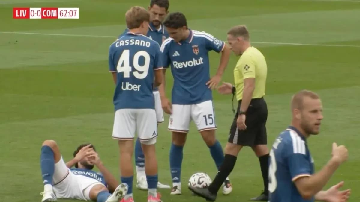 Players attending to an injured teammate on the field